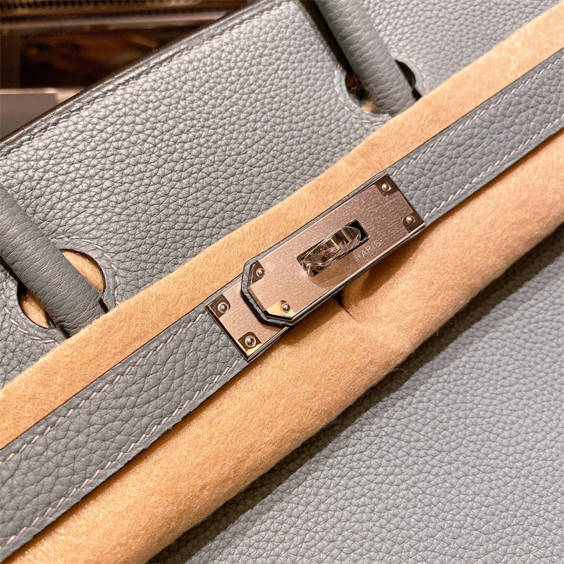  Sophisticated top-handle bag carried on shoulder 10