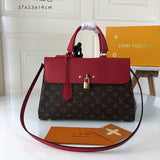 Side profile of classic elevated women's handbag – women's statement bag
