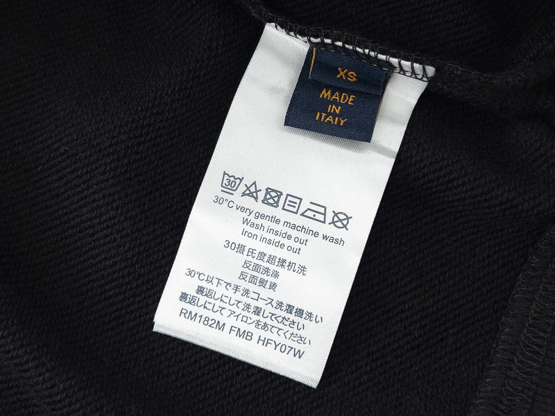 Side profile of Louis Vuitton luxury clothing with signature branding