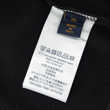 Side profile of Louis Vuitton luxury clothing with signature branding