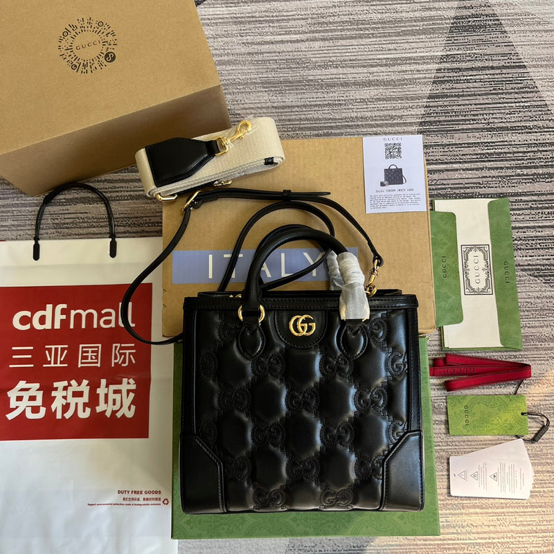 Styled lifestyle shot of signature polished women's handbag – women's luxury handbag