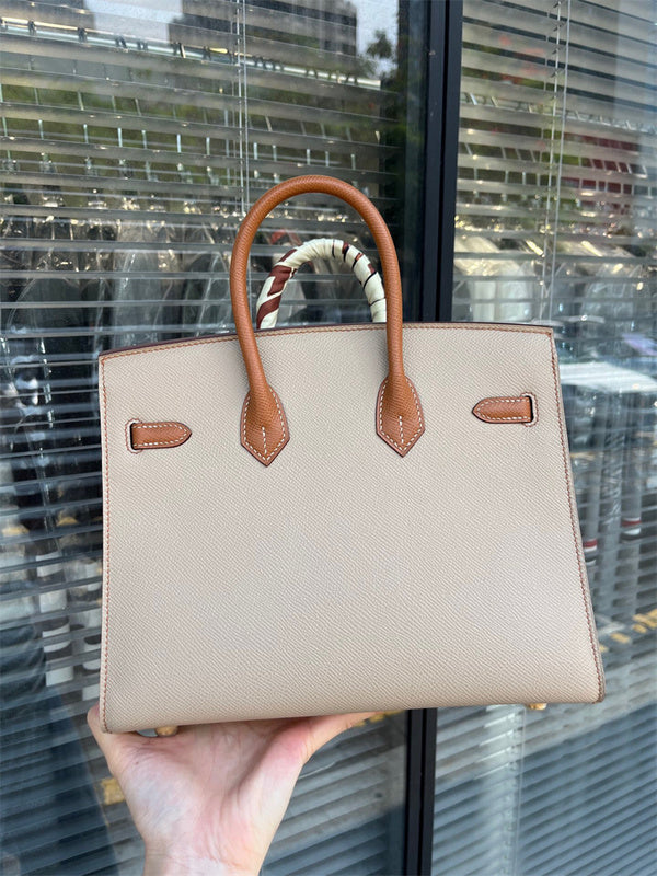 Side view of modern structured handbag