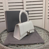 Styled lifestyle shot of elevated signature women's handbag – women's designer-style accessory