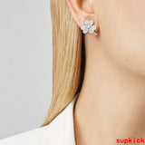 Lifestyle view of Van Cleef & Arpels unisex jewelry piece