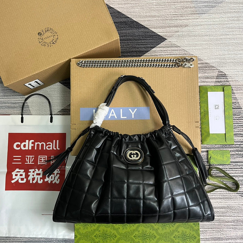 Styled lifestyle shot of polished everyday-luxe women's handbag – women's luxury accessory