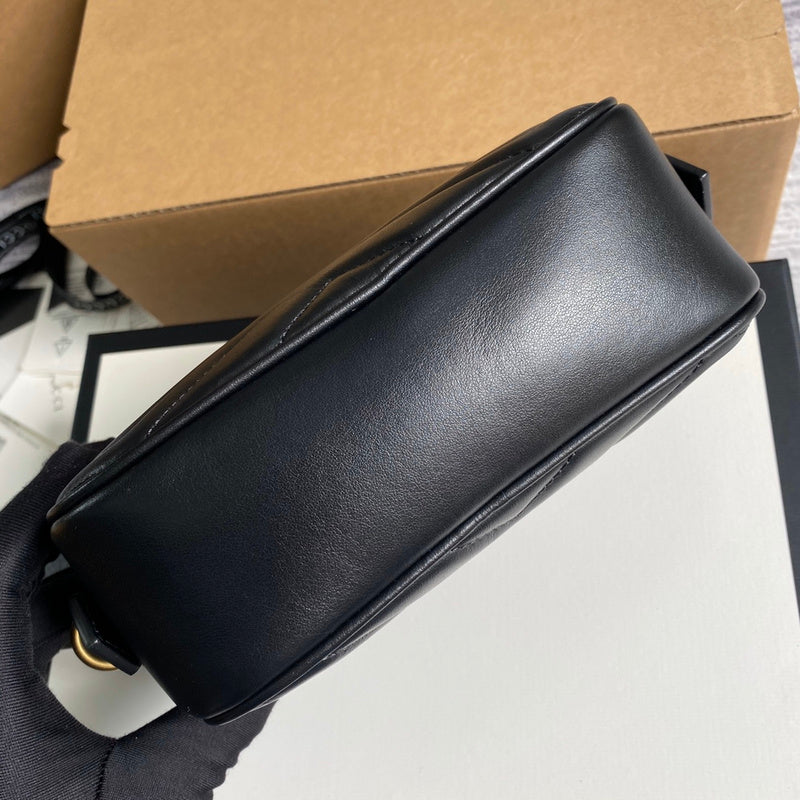 Handle and strap detail of structured signature women's handbag – women's statement bag