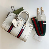 Side profile of statement polished women's handbag – women's everyday handbag