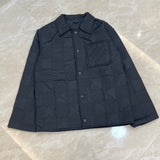 Close-up detail shot of Louis Vuitton luxury clothing with everyday silhouette