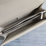 Side profile of elevated modern women's handbag – women's designer-style accessory