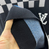 Side profile of Louis Vuitton luxury clothing with logo-detail design