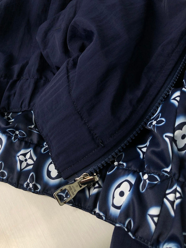 Flat lay presentation of Louis Vuitton luxury clothing with signature branding
