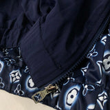 Flat lay presentation of Louis Vuitton luxury clothing with signature branding