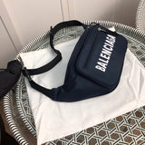 Styled lifestyle shot of signature modern women's handbag – women's luxury handbag