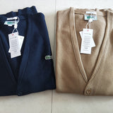 Side profile of Lacoste luxury clothing with monogram-inspired silhouette