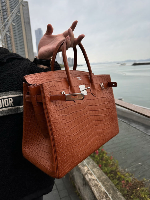 Side view of understated structured handbag