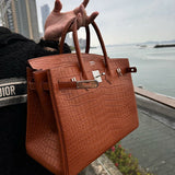 Side view of understated structured handbag