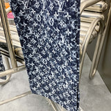 Flat lay presentation of Louis Vuitton luxury clothing with everyday silhouette