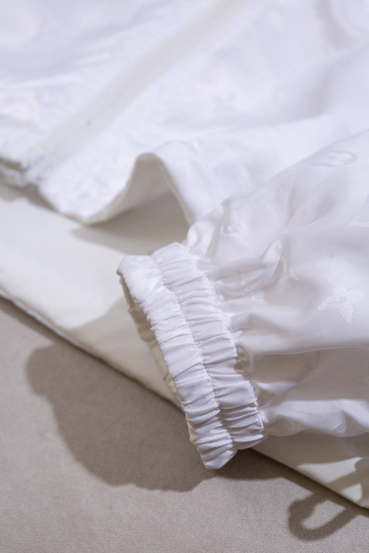 Close-up detail shot of Louis Vuitton luxury clothing with label-forward styling