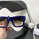 Close-up detail view of Louis Vuitton unisex sunglasses