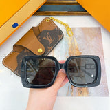 Close-up detail view of Louis Vuitton unisex sunglasses