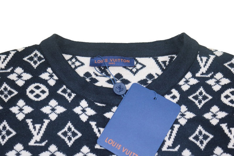 Close-up detail shot of Louis Vuitton luxury clothing with logo-detail design