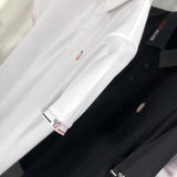 Front view of Moncler luxury clothing with tailored silhouette