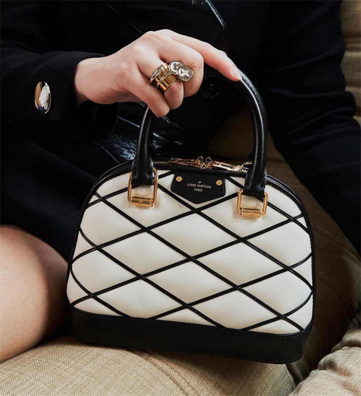  Sleek structured bag carried on shoulder 16