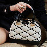  Sleek structured bag carried on shoulder 16