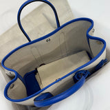 Side view of curated structured handbag