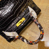 Side view of versatile structured handbag