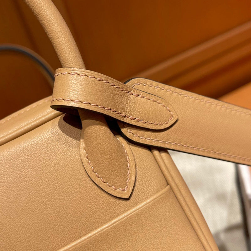 Side view of fluid structured handbag