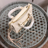 Close-up detail of statement everyday-luxe women's handbag – women's statement bag