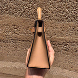 Side view of tailored structured handbag