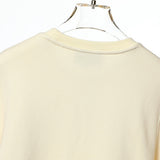 Side profile of Gucci luxury clothing with tailored silhouette