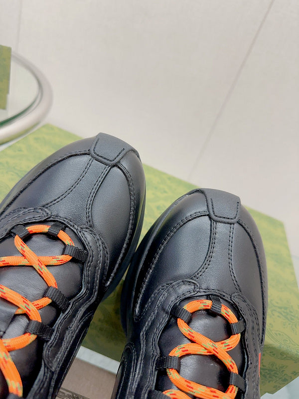 Side profile of Gucci all-black sneakers heritage-inspired look