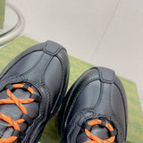 Side profile of Gucci all-black sneakers heritage-inspired look