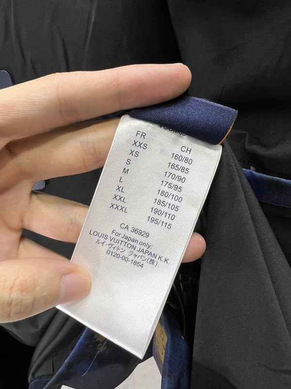 Close-up detail shot of Louis Vuitton luxury clothing with runway-inspired design