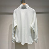 Side profile of Louis Vuitton luxury clothing with monogram-inspired silhouette