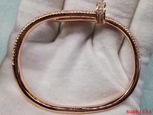 Side view of Cartier unisex jewelry piece