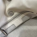 Side profile of chic refined women's handbag – women's luxury accessory