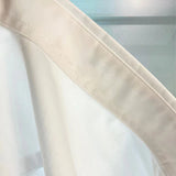 Side profile of Louis Vuitton luxury clothing with tailored silhouette