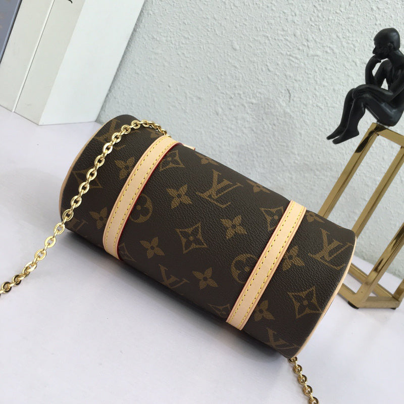 Styled lifestyle shot of polished signature women's handbag – women's luxury accessory
