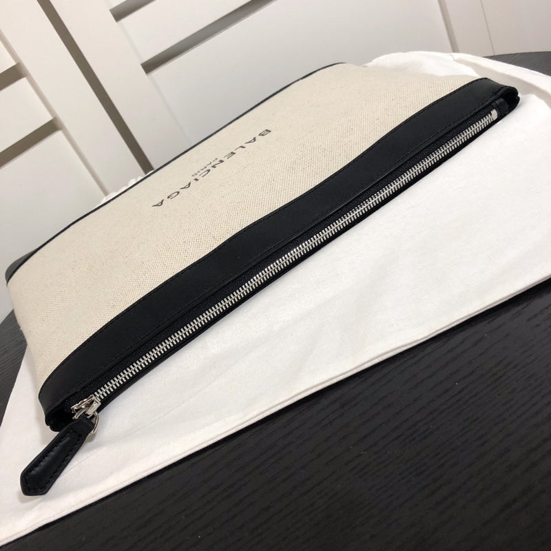Styled lifestyle shot of structured signature women's handbag – women's luxury accessory