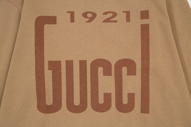 Flat lay presentation of Gucci luxury clothing with contemporary cut