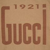 Flat lay presentation of Gucci luxury clothing with contemporary cut