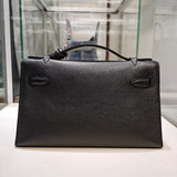Side view of sculpted structured handbag