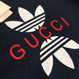 Flat lay presentation of Gucci luxury clothing with relaxed-fit cut