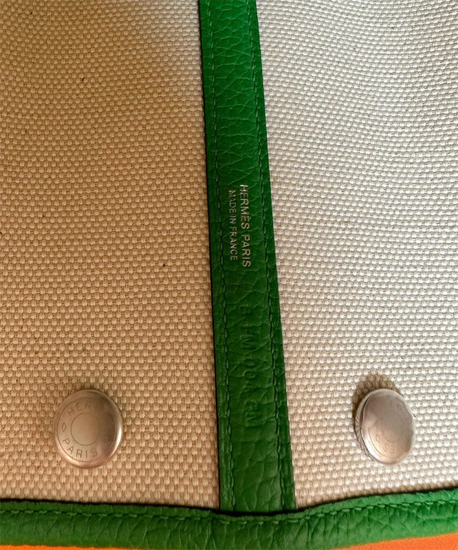  Structured top-handle bag carried on shoulder