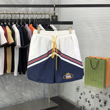 Side profile of Rhude luxury clothing with label-forward styling