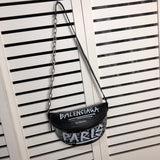 Handle and strap detail of structured everyday-luxe women's handbag – women's designer-style accessory
